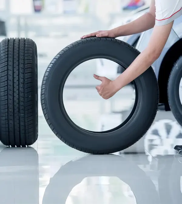 Technician handling a tyre